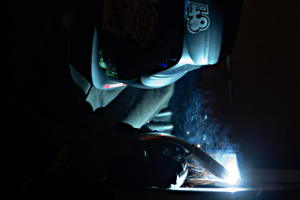 LEADOPTION Senior George Kinerk, 17, of Fort Vancouver High School takes part in Friday&rsquo;s SteelDays welding competition at Clark College.