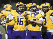 Preston Shearer (16) and Ethan Bumgarner (5) of Columbia River celebrate the Rapids' 24-14 win over Hockinsoin in a 2A Greater St. Helens League football game at Columbia River High School on Friday, Oct. 11, 2024.