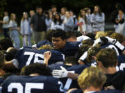 Riah Tua leads the Skyview football team in a post-game prayer after the Storm beat Richland 21-14 in a non-league football game at Kiggins Bowl on Saturday, Oct. 12, 2024.