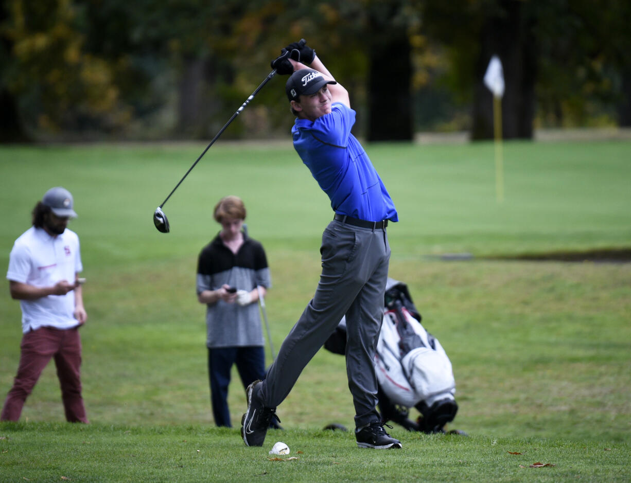 Grady Millar of Mountain View hits a tee shot on the No. 15 hole at Lewis River Golf Course during the 3A district boys golf tournament on Tuesday, Oct. 15, 2024.