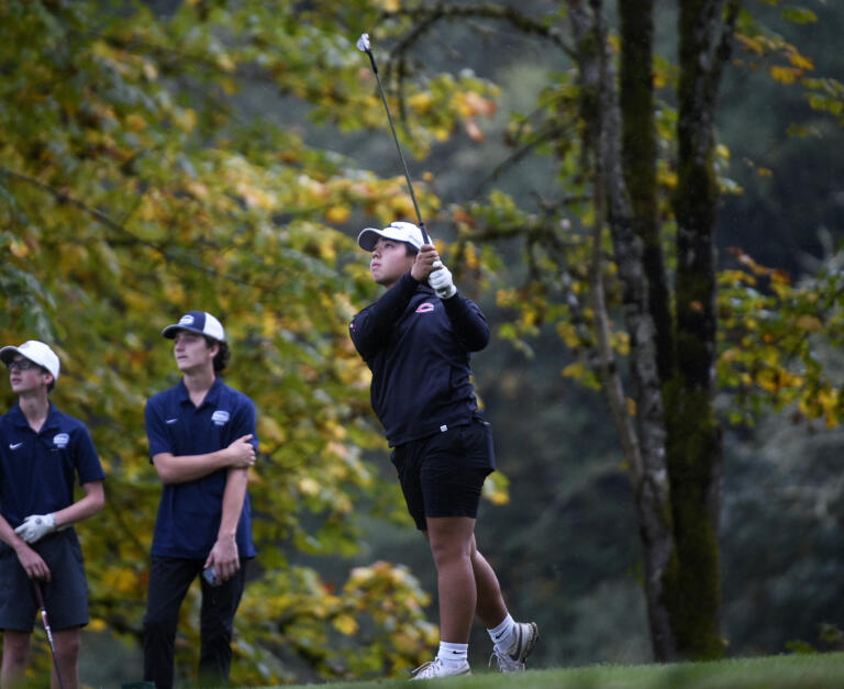 Andre Kosaki of Camas hits off the No. 17 tee at Lewis River Golf Course during the 4A district boys golf tournament on Tuesday, Oct. 15, 2024.