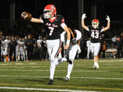 Camas senior Jake Davidson (7) stretches out the football for a touchdown Friday, Oct. 18, 2024, during the Papermakers’ 63-7 win against Battle Ground at Doc Harris Stadium in Camas.