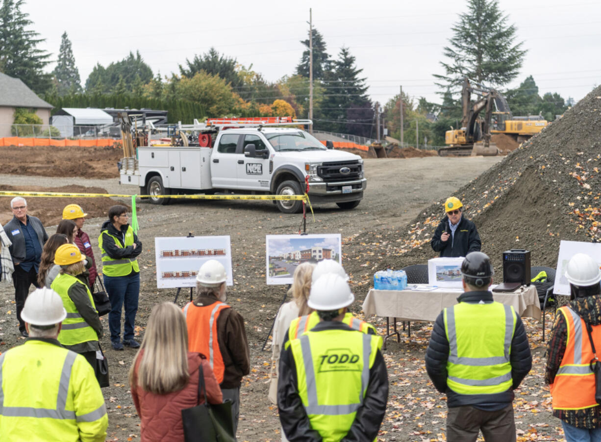 Specialized Housing Executive Director Brian McCarl, right, talks to a crowd full of community members and state leaders including Sen. Annette Cleveland, D-Vancouver, and Clark County Treasurer Alishia Topper on Wednesday in Felida.