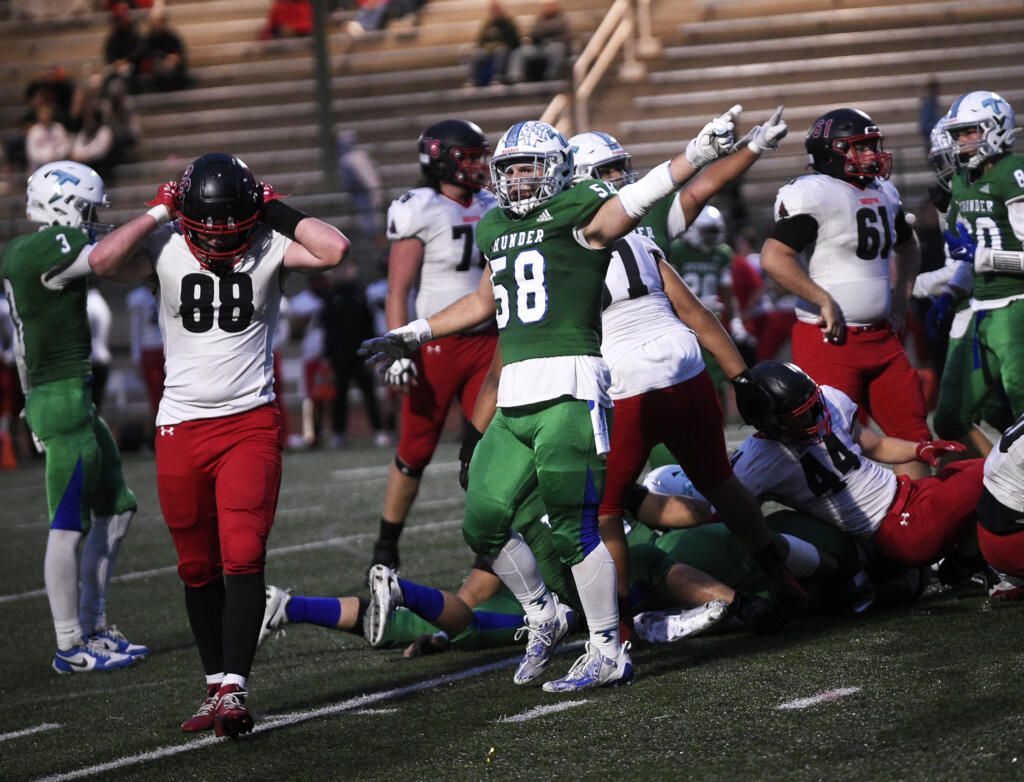 Florian Berani (58) of Mountain View signals that the Thunder recovered a fumble against Shelton in a 3A Greater St. Helens League football game at McKenzie Stadium on Fridayk, Oct. 18, 2024.