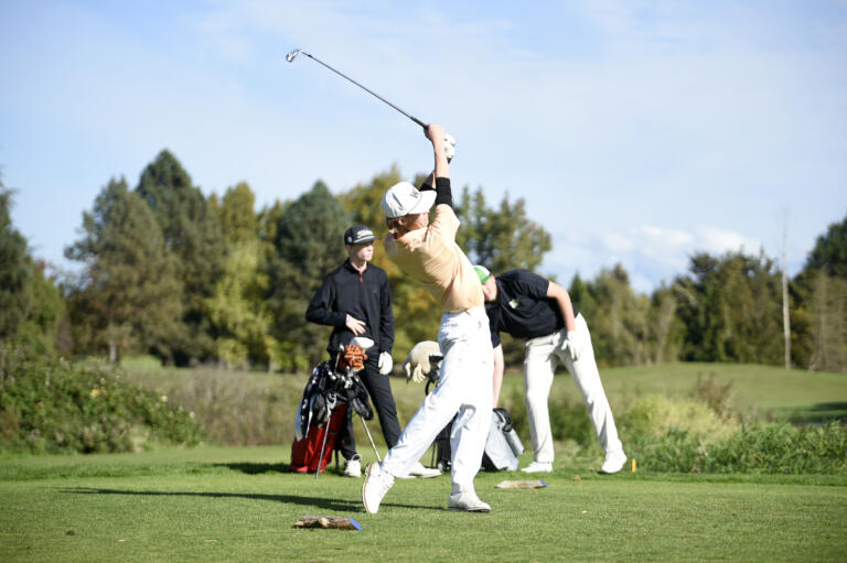 Mason Acker of Washougal hits a tee shot on the No. 15 hole on the Great Blue course at Heron Lakes Golf Course during the 2A boys golf district tournament on Tuesday, Oct. 22, 2024.