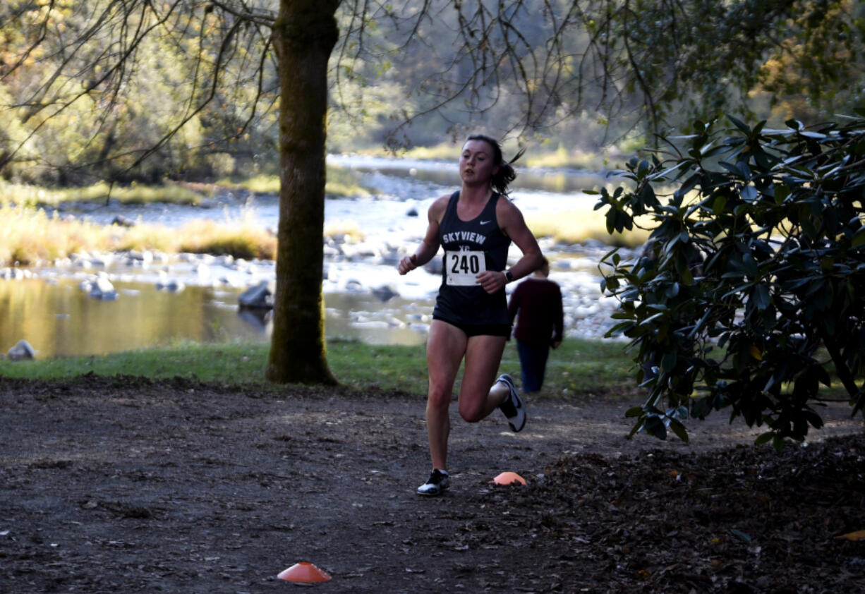 Skyview senior Daphne Evenson races in the Class 4A Greater St. Helens League district cross country championships at Lewisville Park on Wednesday Oct. 23, 2024.