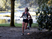 Skyview senior Daphne Evenson races in the Class 4A Greater St. Helens League district cross country championships at Lewisville Park on Wednesday Oct. 23, 2024.