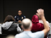 An audience member raises his hand as Interim Vancouver Police Chief Troy Price listens to a question Wednesday during a forum at Evergreen Public Schools Administrative Service Center. Price is the only finalist to take over as chief for Vancouver police.