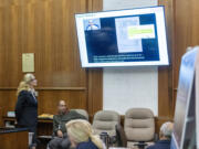 Attorney Renee Rothauge, left, shows a video clip to jurors Monday during the wrongful death trial filed by the family of Effie Entezari, who was killed in 1989. She promised to show the jury evidence that the defendant in the suit, Viktor Pell, was responsible for Entezari&rsquo;s death, despite the woman&rsquo;s estranged husband being convicted of the crime and serving 16 years in prison.