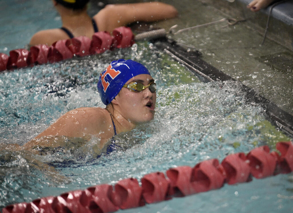 Rebecca Yamada of Ridgefield touches the wall at the end of the 200-yard free relay at the Southwest Washington Invitational girls swim meet at Mark Morris High School in Longview on Saturday, Oct. 26, 2024.