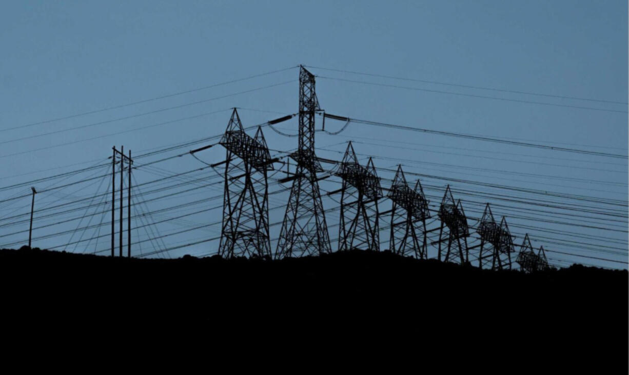 Powerlines above the Columbia River move electricity from the Bonneville Dam to customers across the region in Hood River County, Oregon, on Thursday, July 25, 2024.