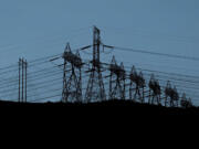 Powerlines above the Columbia River move electricity from the Bonneville Dam to customers across the region in Hood River County, Oregon, on Thursday, July 25, 2024.