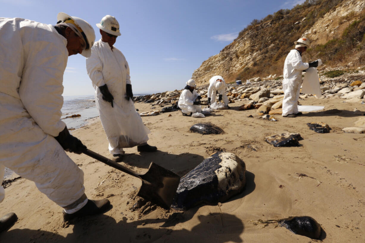 An environmental cleanup crew removes oily sand at Refugio State Beach in Santa Barbara County in May 2015 after a massive spill from a ruptured pipeline.