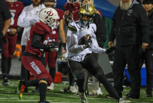 Ryder Keplar of Evergreen runs the ball against Prairie during a 3A Greater St. Helens League game Friday at District Stadium in Battle Ground. (Chris Barker/For The Columbian)