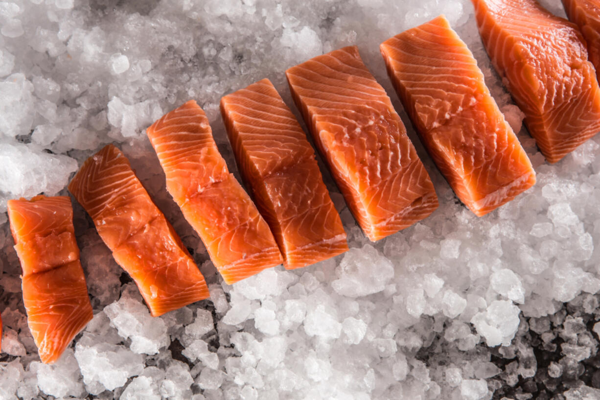 Place salmon, skin side down, on the baking sheet. Spray salmon with olive oil spray. Place on middle rack in oven for 15 minutes or until salmon is just cooked through. When a knife is inserted into the fish, the flesh should be opaque, not translucent.