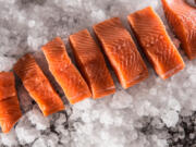 Place salmon, skin side down, on the baking sheet. Spray salmon with olive oil spray. Place on middle rack in oven for 15 minutes or until salmon is just cooked through. When a knife is inserted into the fish, the flesh should be opaque, not translucent.