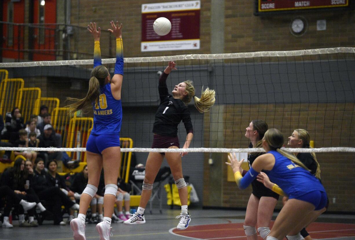 Prairie's Alivia Snyder (1) attempts to hit past Kelso's Sheena McGregor (10) during a 3A Greater St. Helens League volleyball match on Thursday, Oct. 24, 2024, at Prairie High School.