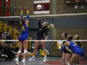 Prairie's Alivia Snyder (1) attempts to hit past Kelso's Sheena McGregor (10) during a 3A Greater St. Helens League volleyball match on Thursday, Oct. 24, 2024, at Prairie High School.