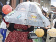 A person wears a flying saucer during a costume parade at the Chehalis Flying Saucer Party on .Sept. 14.