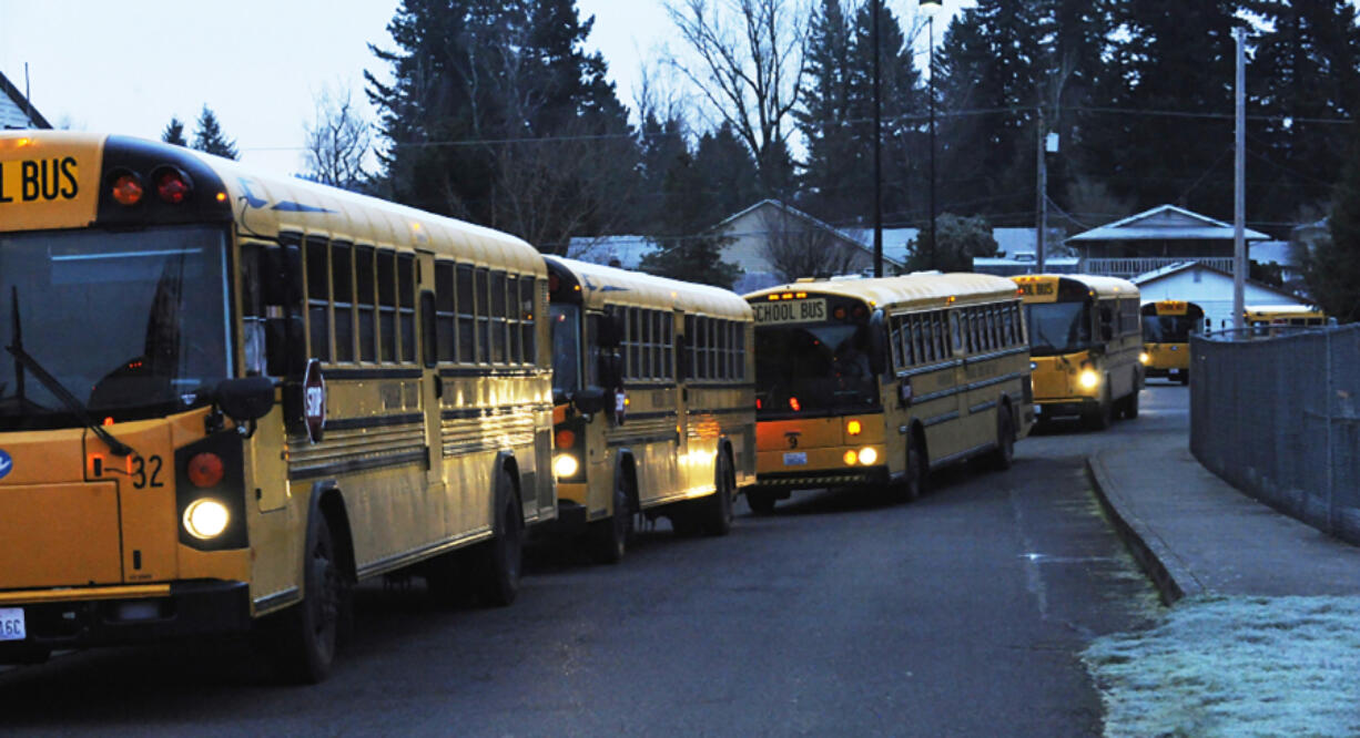 Washougal school buses wait to collect students in 2018.