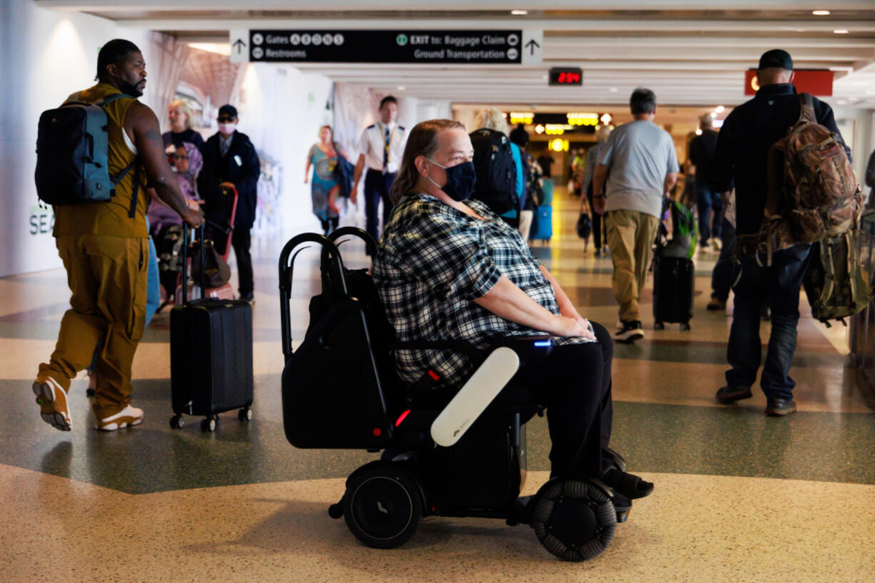 Billings resident Tina Gellos travels to her gate using an autonomous wheelchair at Seattle-Tacoma International Airport on Oct. 3, 2024.