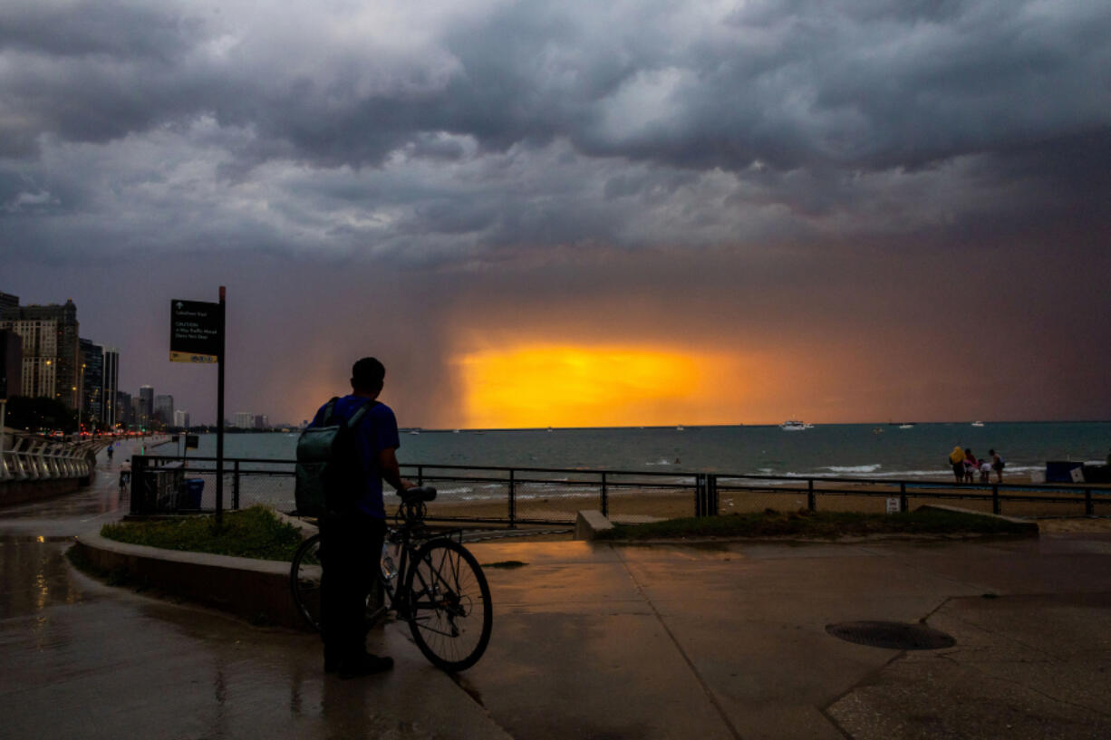 A storm rolls in at Ohio Street Beach after a day of the heat index at triple digits on Aug. 27, 2024.