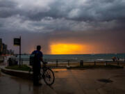 A storm rolls in at Ohio Street Beach after a day of the heat index at triple digits on Aug. 27, 2024.