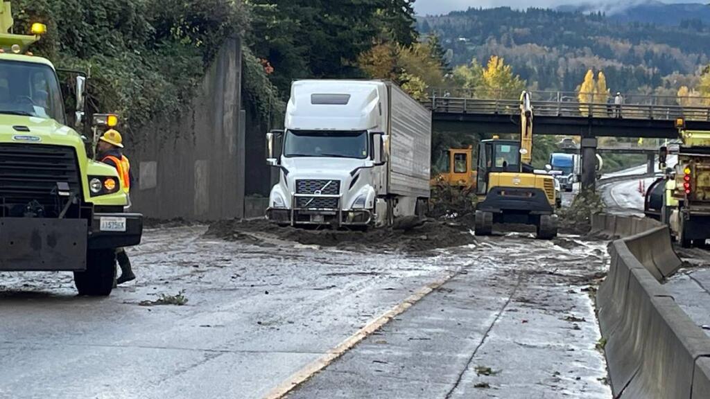 A semi trailer truck is stuck in a mudslide on Interstate 5 near a pedestrian crossing north of the Iowa Street overpass. The driver was uninjured, the Bellingham Fire Department said.