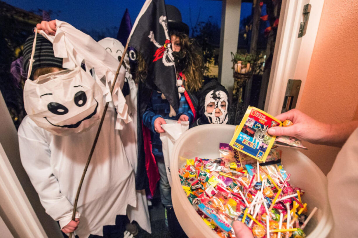 Checking children&rsquo;s trick-or-treat candy is a standard safety measure.