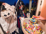 Checking children&rsquo;s trick-or-treat candy is a standard safety measure.