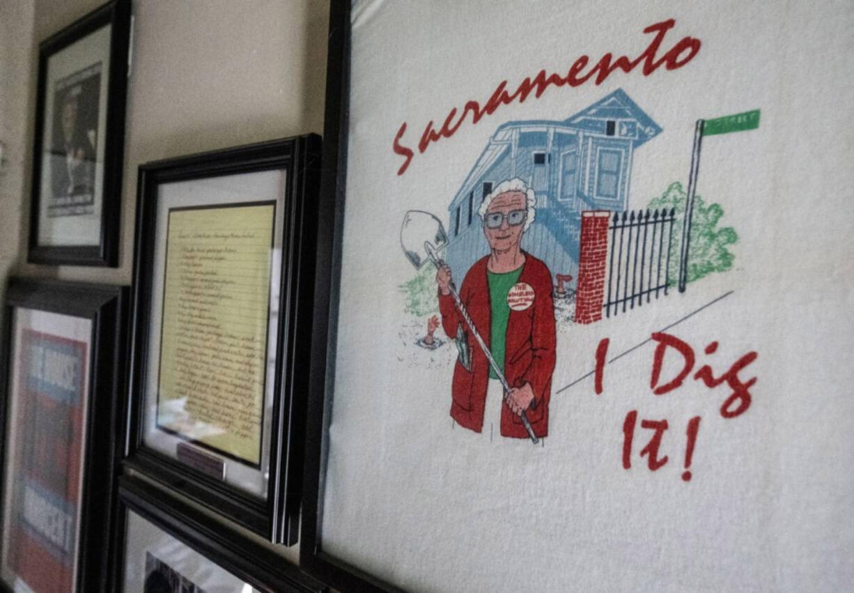 A framed &ldquo;Sacramento &mdash; I dig it!&rdquo; T-shirt depicting notorious Sacramento serial killer Dorothea Puente hangs amid other memorabilia about the case on the wall of her former F Street home on Oct. 18.