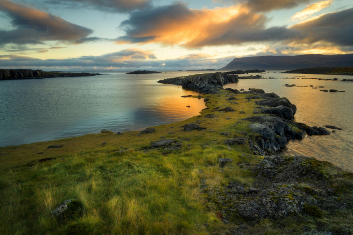 The Atlantic Ocean seen from a small fjord in Iceland&rsquo;s Westfjords region.