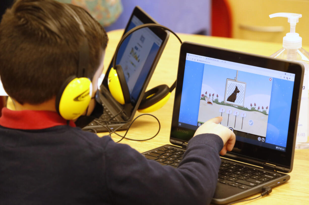 A student works on a computer Feb. 10, 2021, at Freedom Preparatory Academy in Provo, Utah.