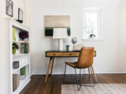 A simple desk and chair creates a functional place to work in this home.