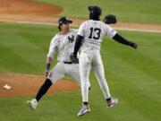 New York Yankees&#039; Jazz Chisholm Jr. (13) and Oswaldo Cabrera celebrate after Game 1 of the baseball AL Championship Series against the Cleveland Guardians Monday, Oct. 14, 2024, in New York. The Yankees won 5-2.