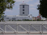 FILE - The largest regulated water and wastewater utility company in the U.S., American Water, its building in Camden, N.J., seen in the foreground on June 17, 2024, says it was the victim of a cyberattack, prompting the firm to pause billing to customers.