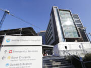 A sign stands outside Seattle Children's Hospital on March 18, 2020, in Seattle.