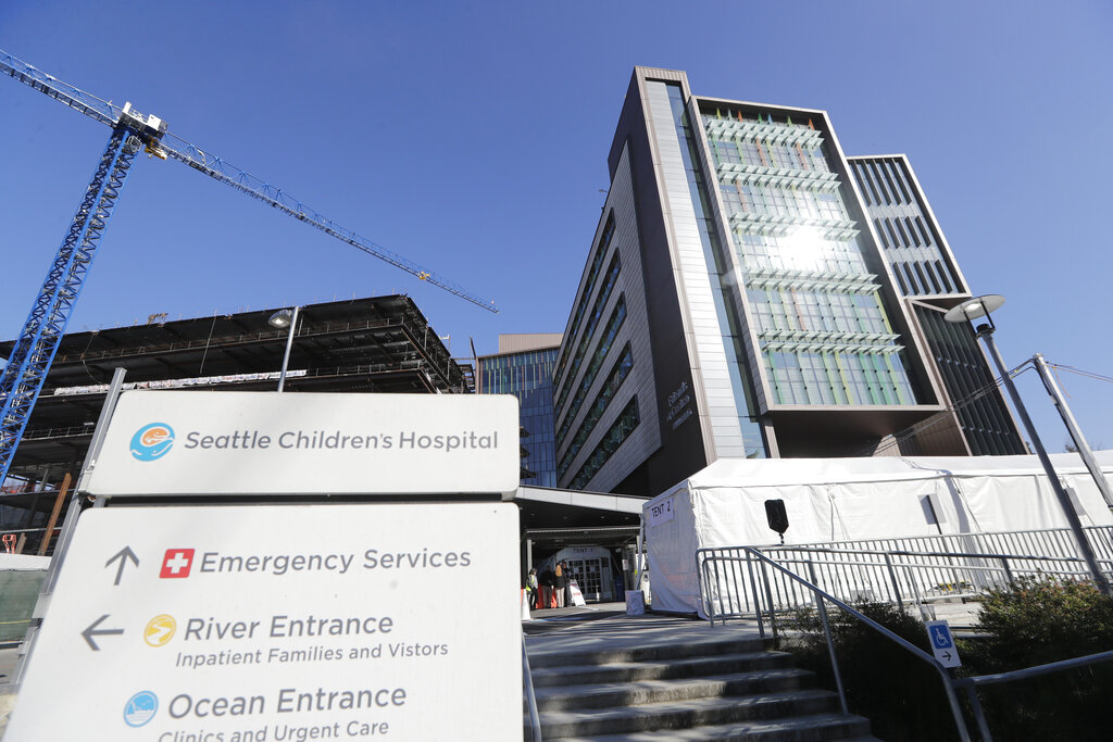 A sign stands outside Seattle Children's Hospital on March 18, 2020, in Seattle.