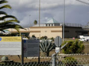 FILE - The Federal Correctional Institution stands in Dublin, Calif., Dec. 5, 2022.  The federal Bureau of Prisons says it is planning to close a women’s prison in California known as the “rape club” despite attempts to reform the troubled facility after an Associated Press investigation exposed rampant staff-on-inmate sexual abuse.