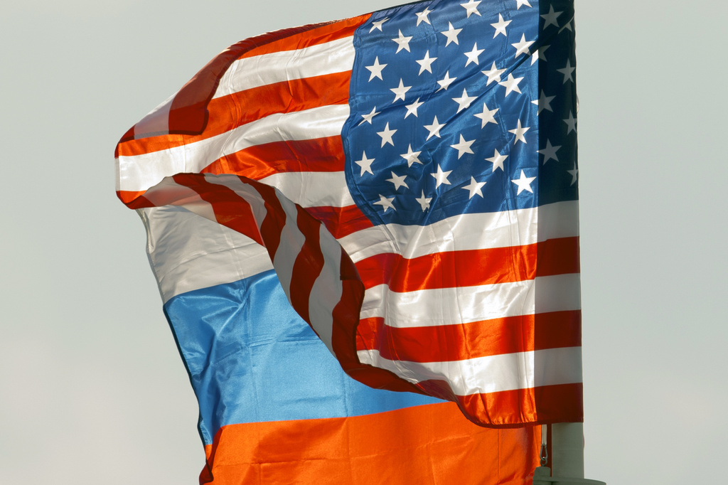 FILE - U.S. and Russian national flags wave on the wind in Moscow's Vnukovo airport, Russia, April 11, 2017 to welcome a U.S. dignitary.