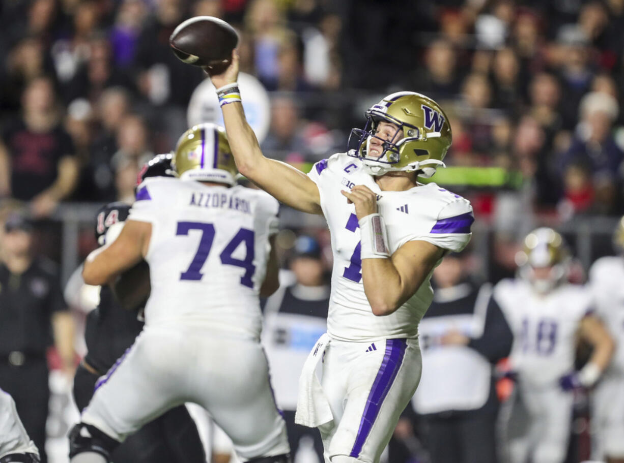 Washington quarterback Will Rogers (7) throws a pass during the first half of an NCAA college football game against Rutgers, Friday, Sept. 27, 2024, in Piscataway, N.J.