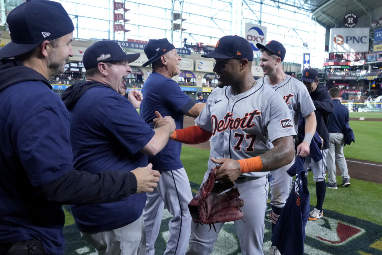 Detroit Tigers' Andy Ibanez (77) celebrates with the team and staff after their 5-2 win against the Houston Astros in Game 2 of an AL Wild Card Series baseball game Wednesday, Oct. 2, 2024, in Houston. (AP Photo/Kevin M.