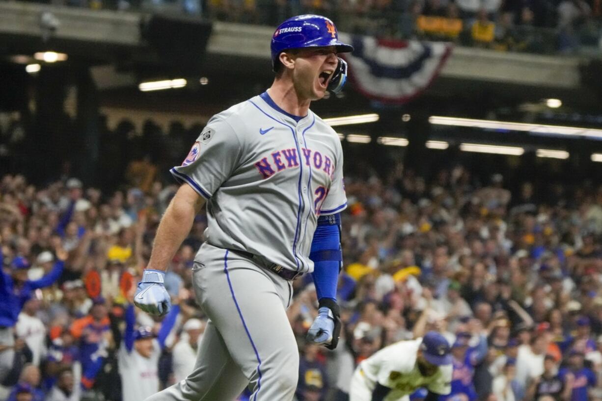 New York Mets' Pete Alonso reacts after hitting a three-run home run during the ninth inning of Game 3 of a National League wild card baseball game against the Milwaukee Brewers Thursday, Oct. 3, 2024, in Milwaukee.