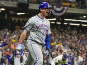 New York Mets' Pete Alonso reacts after hitting a three-run home run during the ninth inning of Game 3 of a National League wild card baseball game against the Milwaukee Brewers Thursday, Oct. 3, 2024, in Milwaukee.