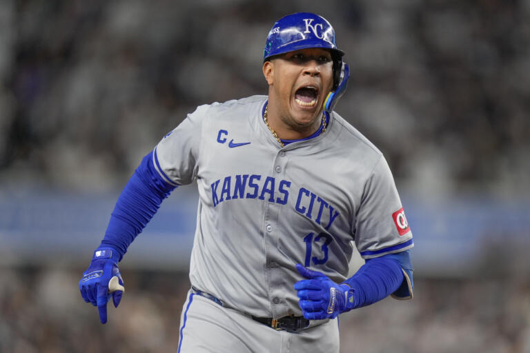 Kansas City Royals' Salvador Perez (13) reacts after hitting a solo home run against the New York Yankees during the fourth inning of Game 2 of the American League baseball playoff series, Monday, Oct. 7, 2024, in New York.