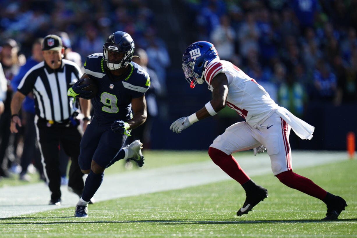 Seattle Seahawks running back Kenneth Walker III (9) runs with the ball during an NFL football game against the New York Giants, Sunday, Oct. 6, 2024 in Seattle. The Giants won 29-20.