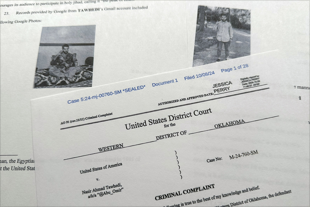 The criminal complaint, filed by the Justice Department, against Nasir Ahmad Tawhedi, 27,of Oklahoma City is photographed Tuesday, Oct. 8, after the FBI arrested the man who officials say was inspired by the Islamic State militant organization and was plotting an Election Day attack targeting large crowds in the U.S.