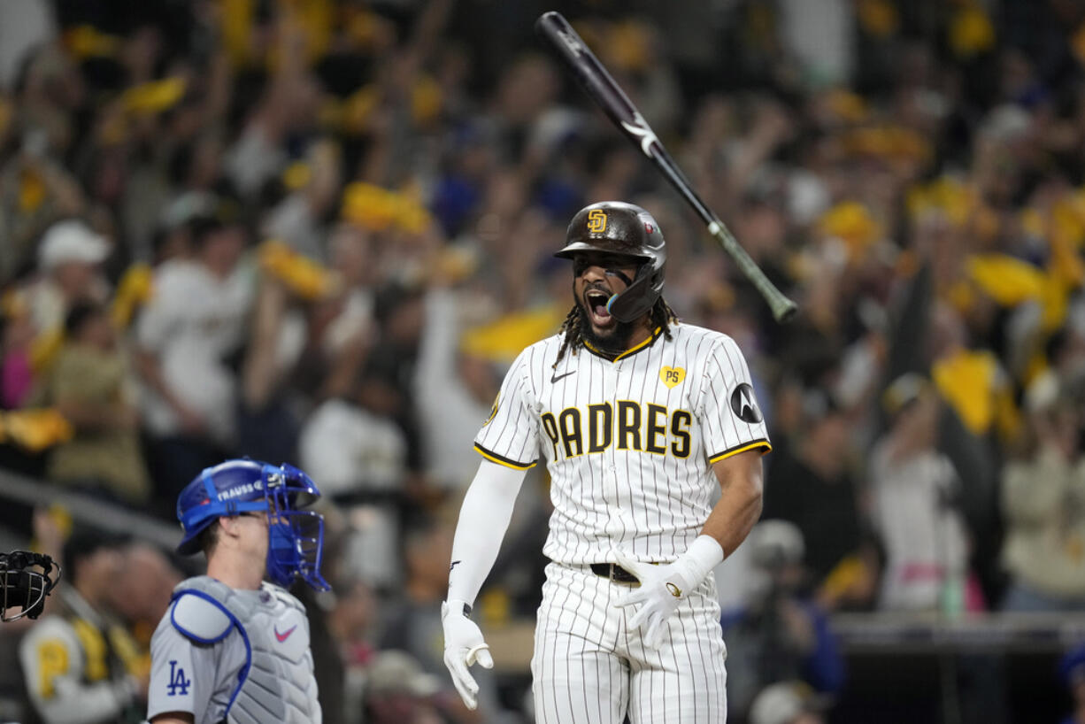 San Diego Padres' Fernando Tatis Jr. tosses his bat after hitting a two-run home run during the second inning in Game 3 of a baseball NL Division Series against the Los Angeles Dodgers, Tuesday, Oct. 8, 2024, in San Diego.