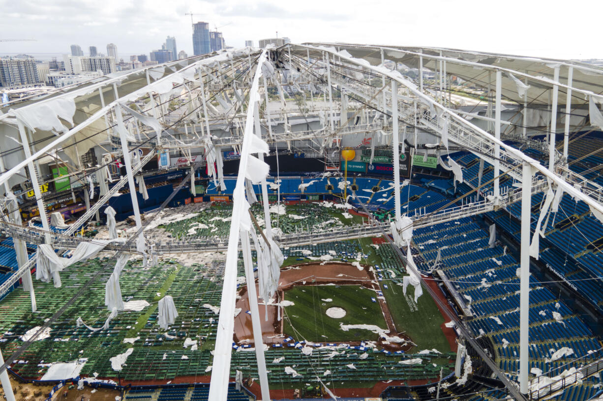 The roof of the Tropicana Field is damaged the morning after Hurricane Milton hit the region, Thursday, Oct. 10, 2024, in St. Petersburg, Fla.