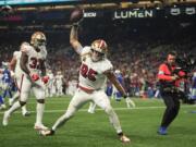 San Francisco 49ers' George Kittle (85) reacts after a touchdown against the Seattle Seahawks, Thursday, Oct. 10, 2024, in Seattle.